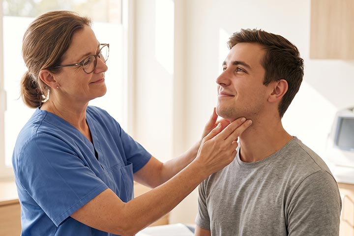 Doctor examining male patient.