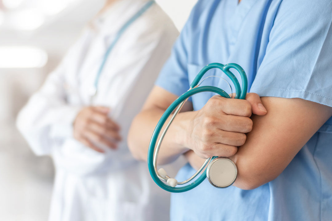 Close up of two physicians.