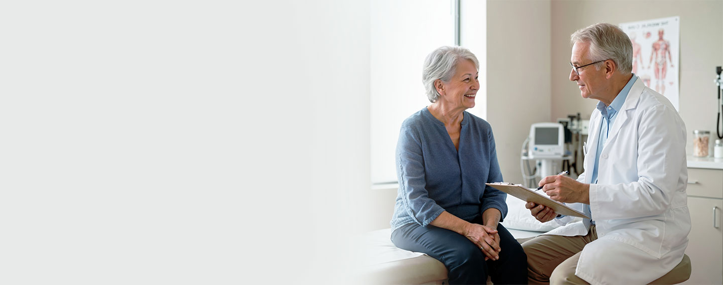Doctor consulting with elderly female patient.